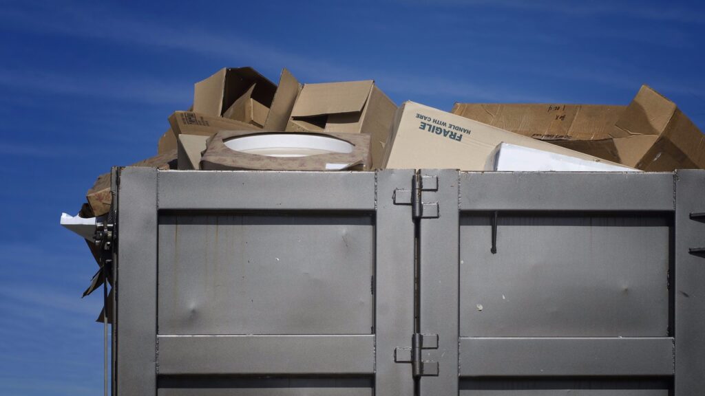 dumpster filled with commercial junk